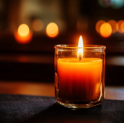 Glass memorial candle representing compassionate cremation planning support in Mount Summit, IN.