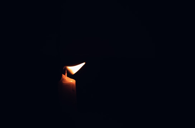 Burning memorial candle representing funeral homes in Mount Summit, IN.