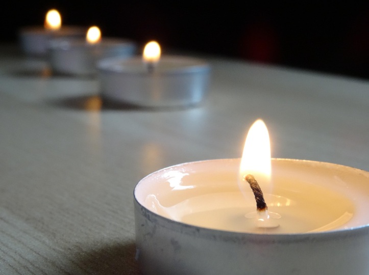Lit memorial candles representing remembrance after cremation in New Castle, IN.